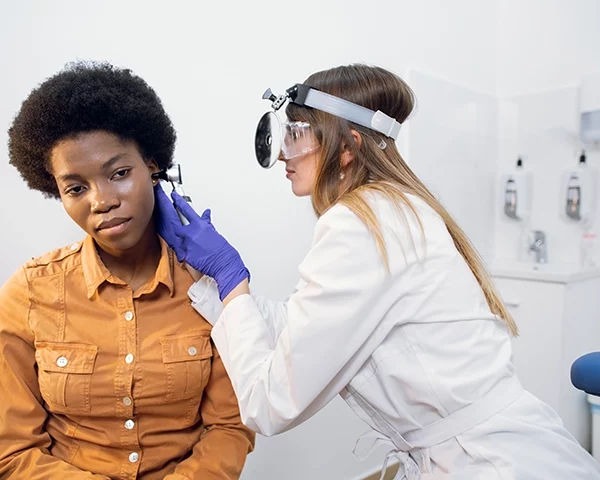 Audiologist performing a hearing test