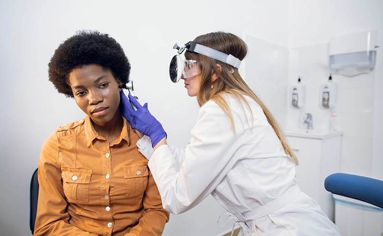 Audiologist performing a hearing test